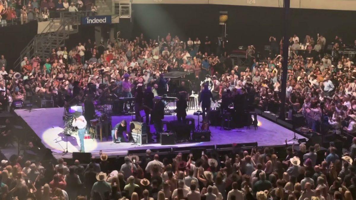 George Strait leads the crowd into singing Happy Birthday to Willie Nelson